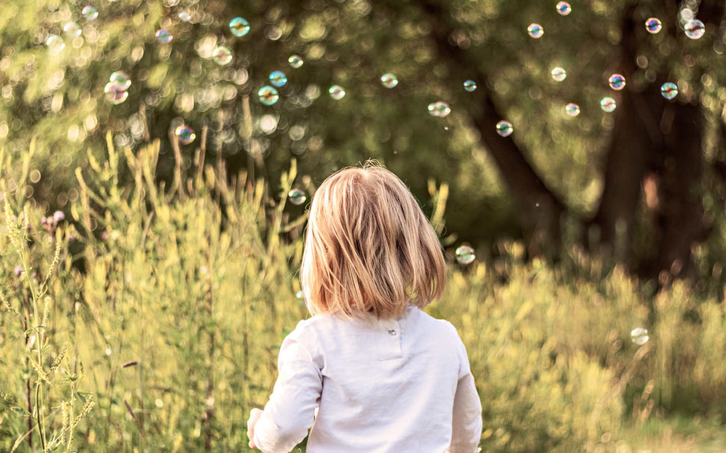 Child Playing With Bubbles