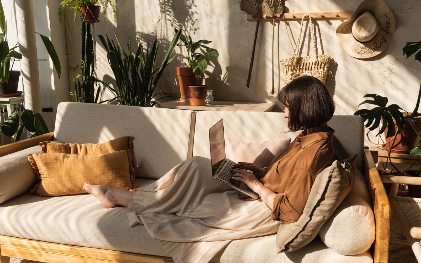 Woman on Couch With Laptop
