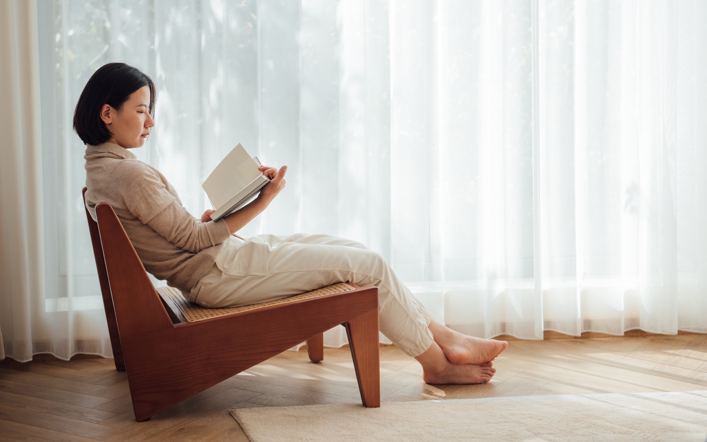 Woman Reading On Chair