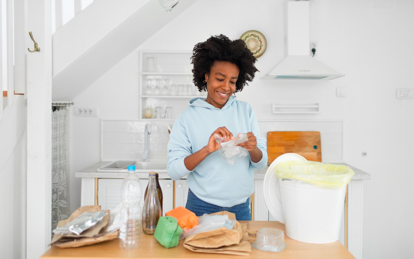 Woman Separating Her Recycling