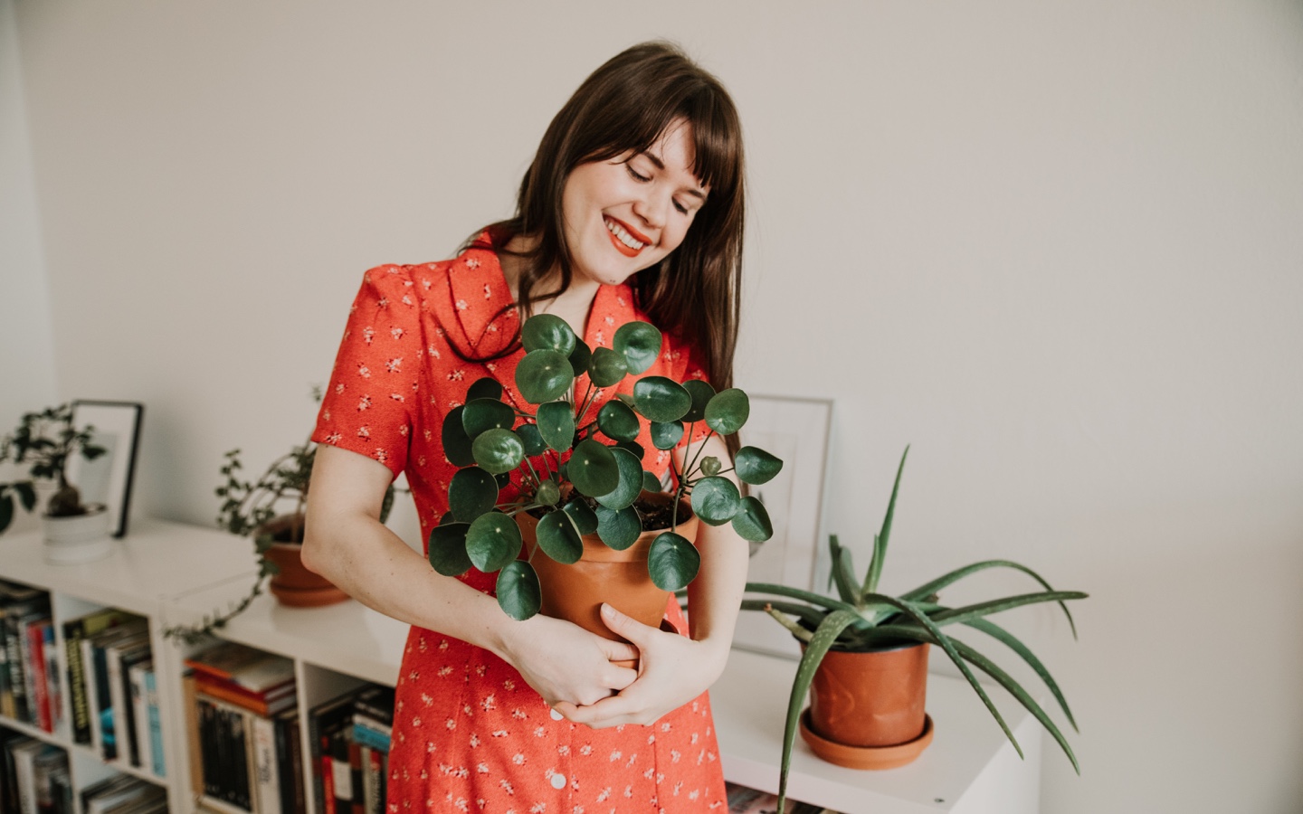 Woman Holding Pilea Plant