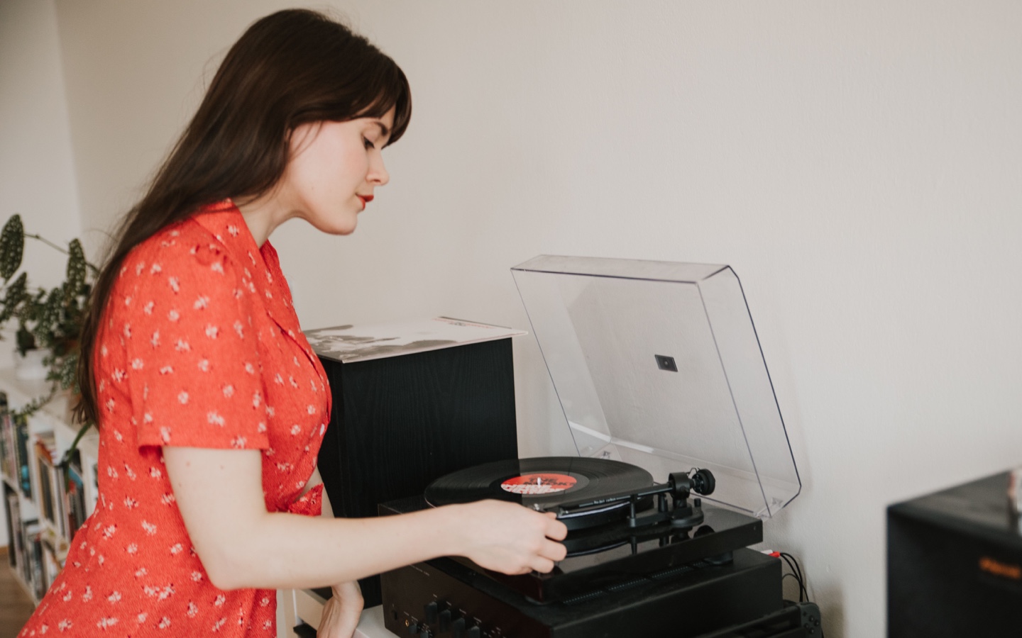 Woman Spinning Record On Turnable
