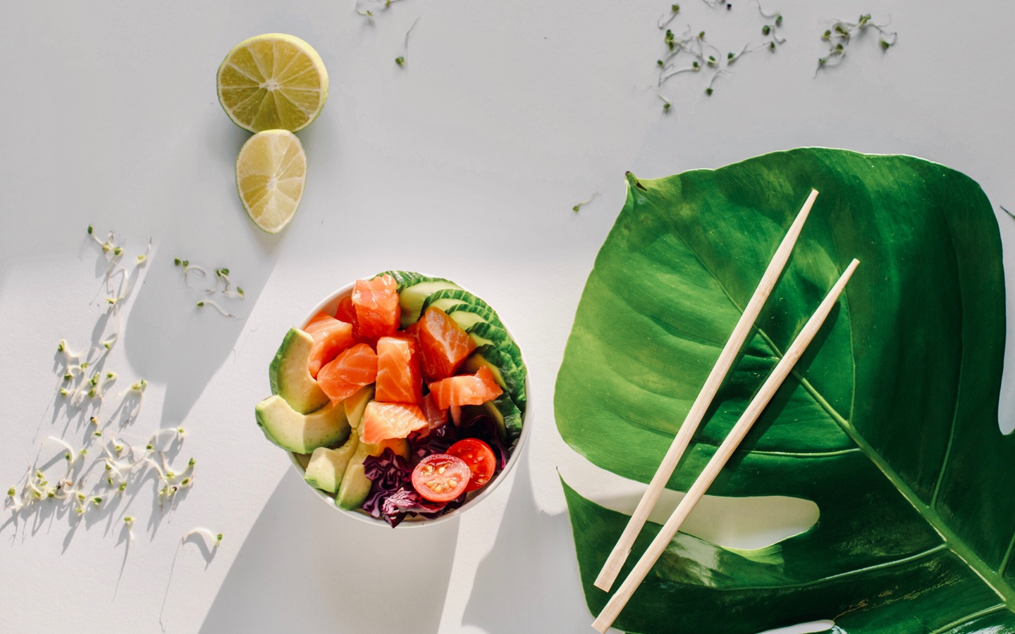 Poke Bowl Styled With Chopsticks and Monstera Leaf