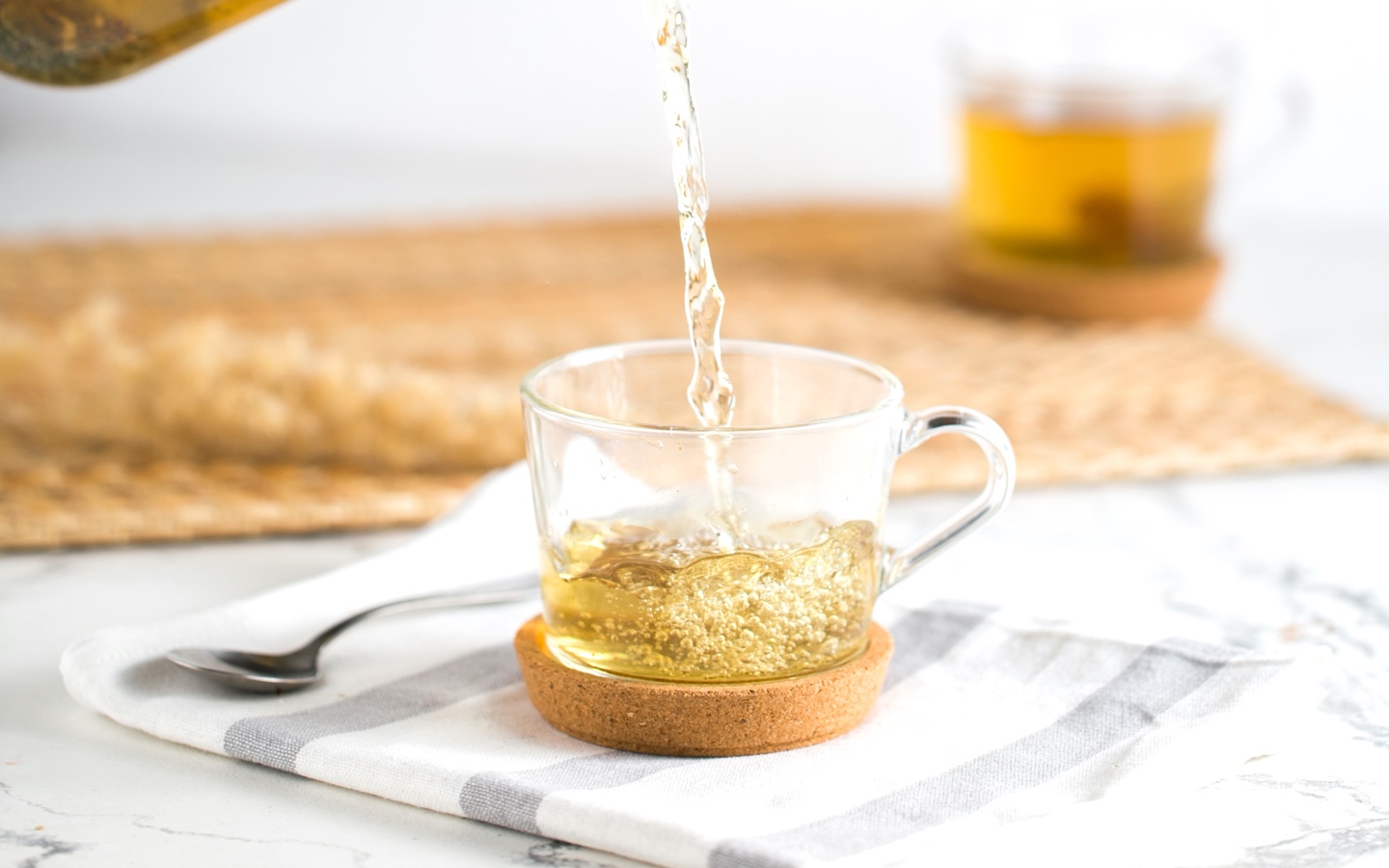 Pouring A Cup of Green Tea