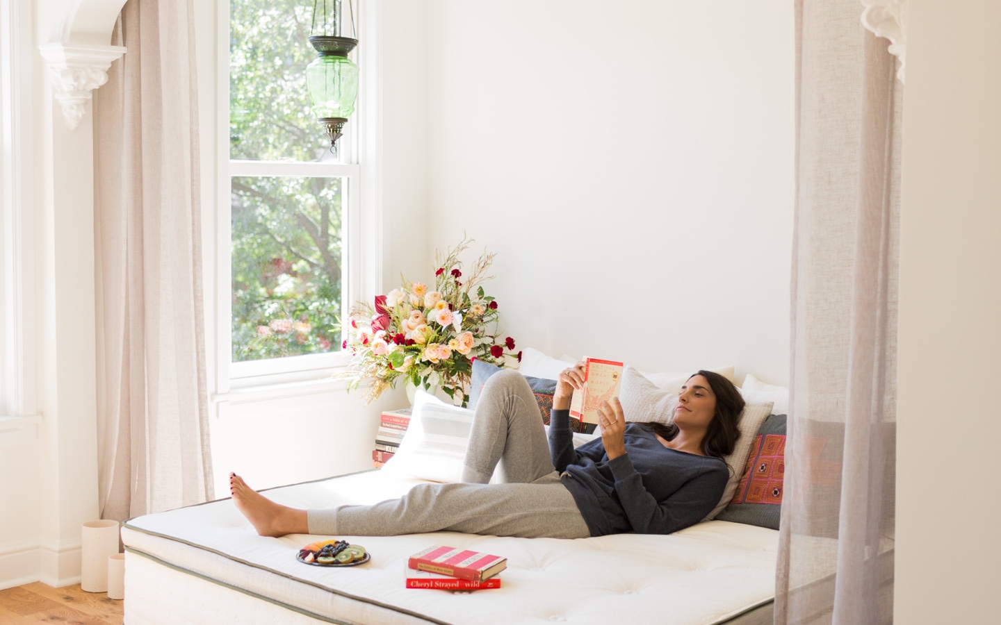 Woman Reading in Bed