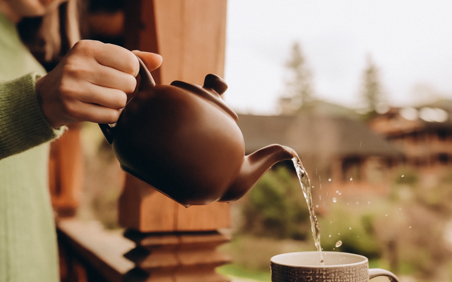 Pouring Hot Water Into Tea Cup