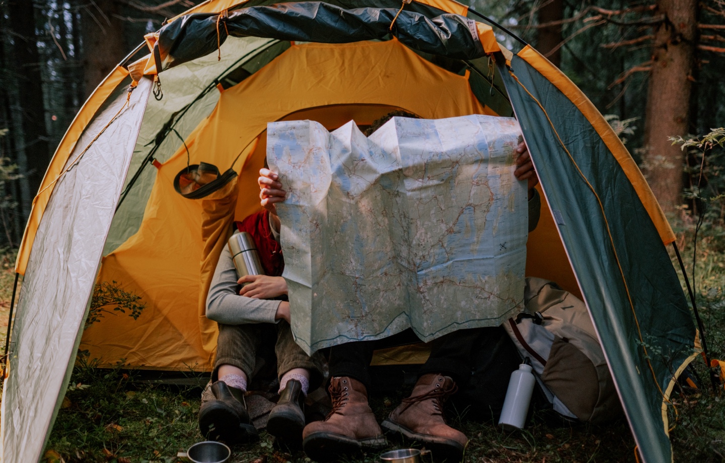 https://magazine.avocadogreenmattress.com/wp-content/uploads/2022/08/Looking-At-A-Map-While-Camping.jpg