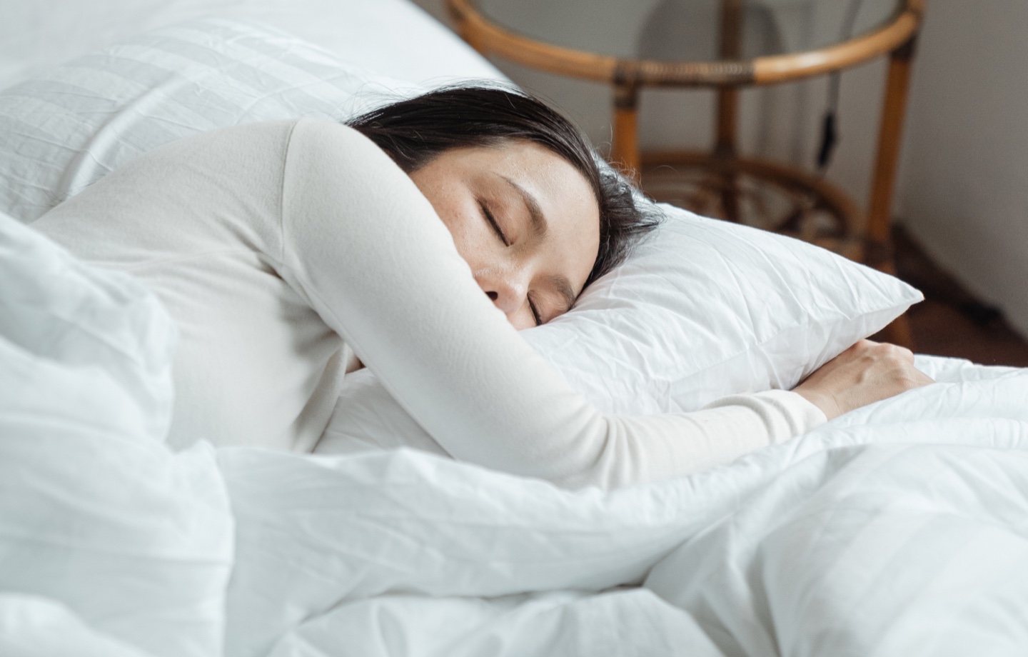 Woman Sleeping In Bed Header