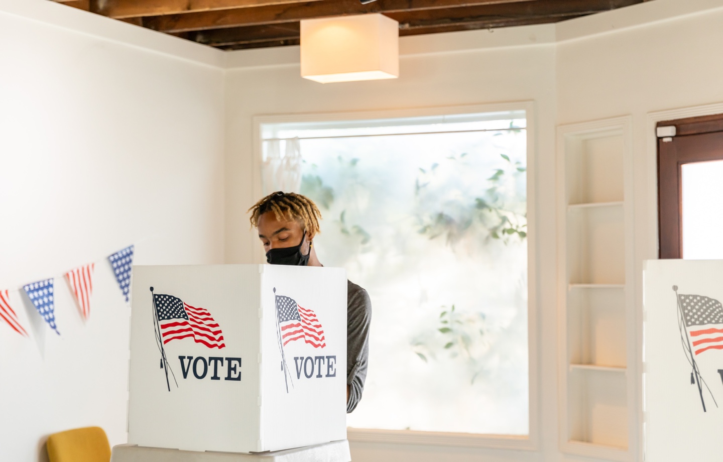 Man Voting At Polling Station