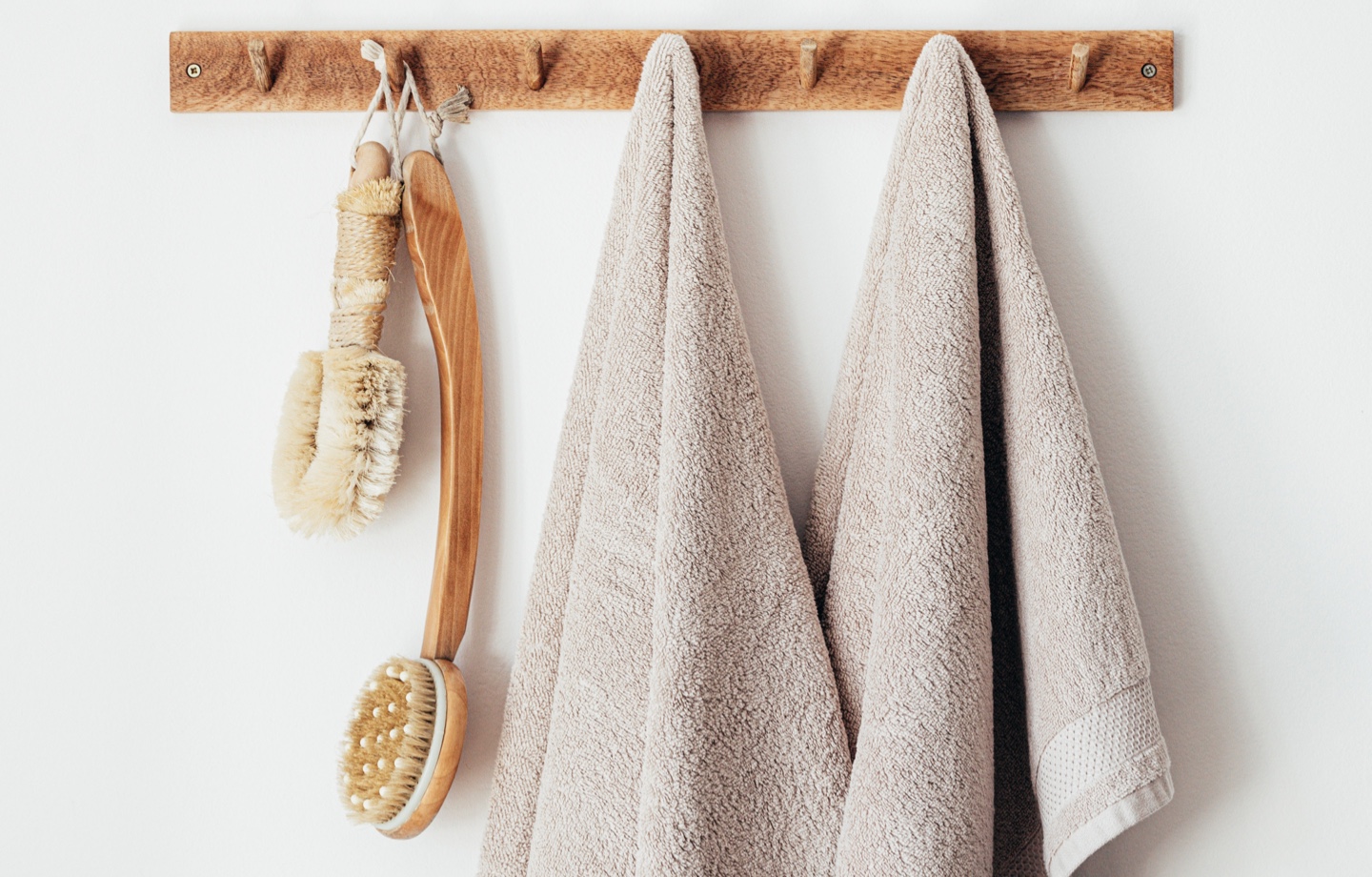 dry brush and towels hanging on rack