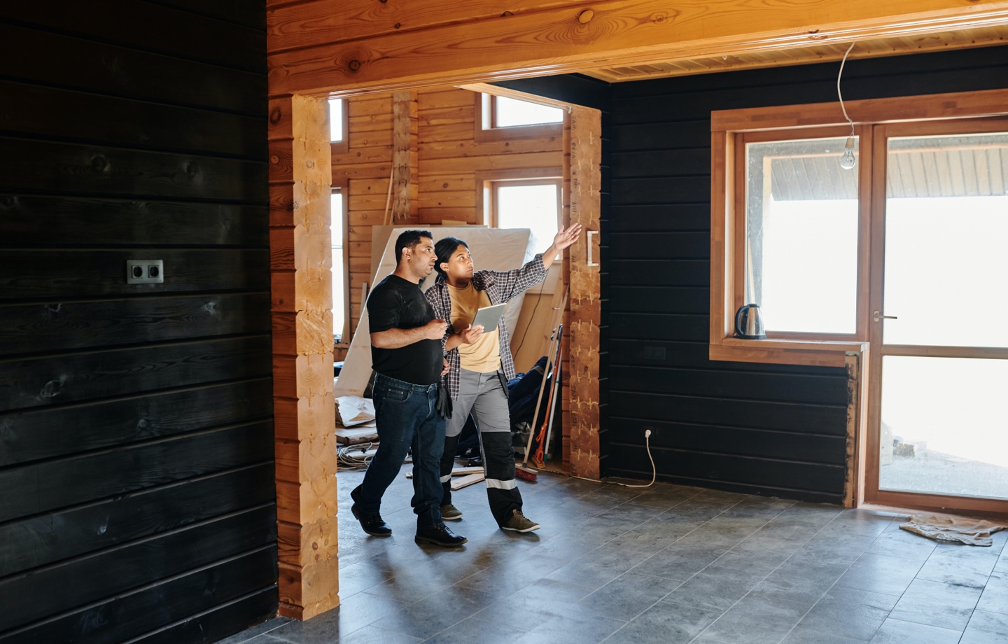 home owners walking through home renovation