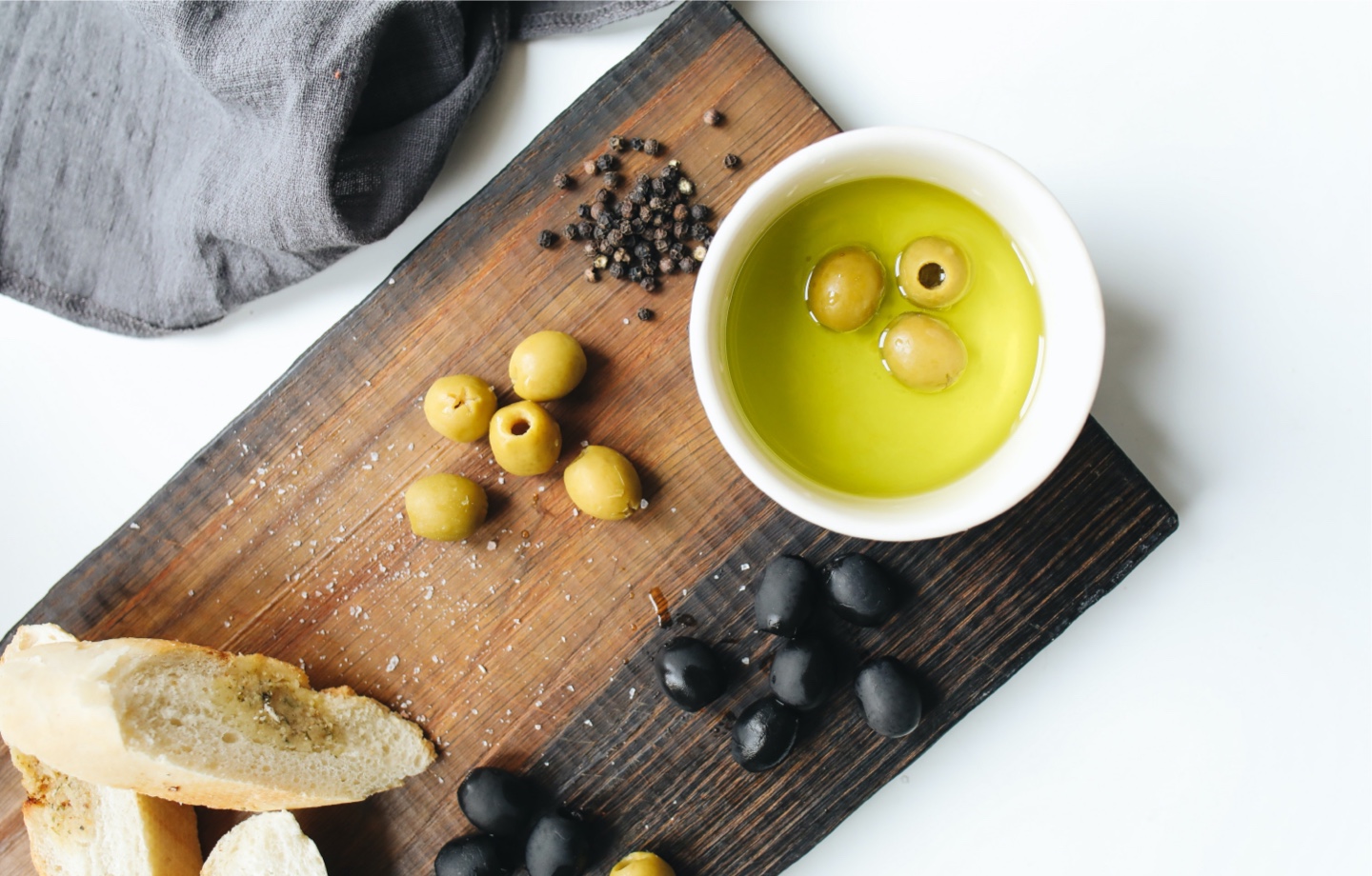 olive oil with bread and olives