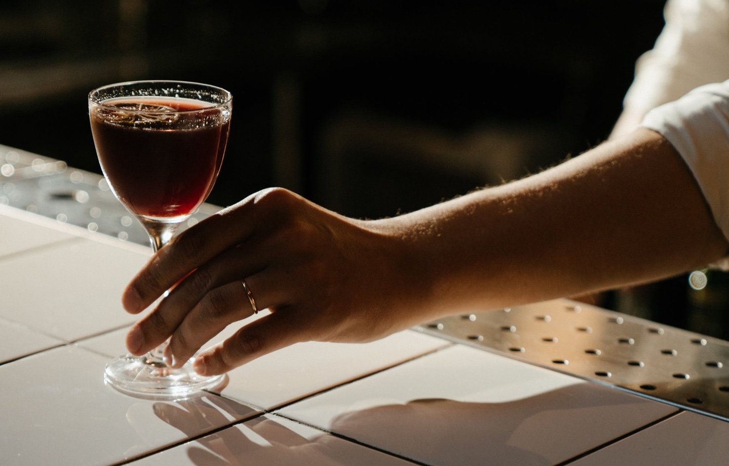 woman holding glass of sleepy girl mocktail