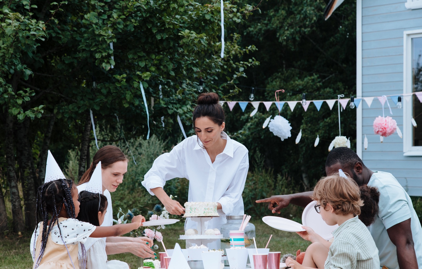 serving cake at kids party picnic