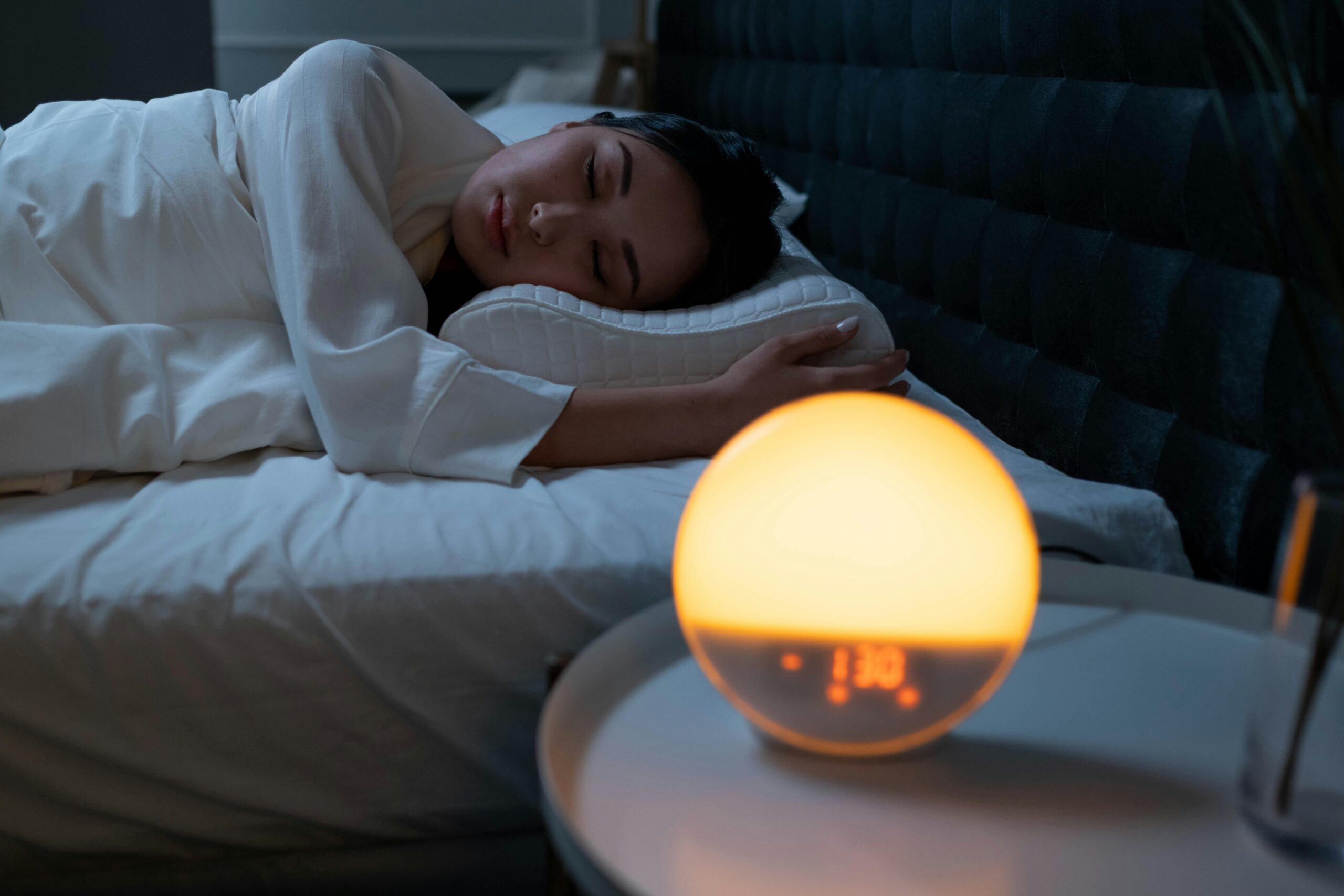 Pexels- woman sleeping in bed with alarm clock