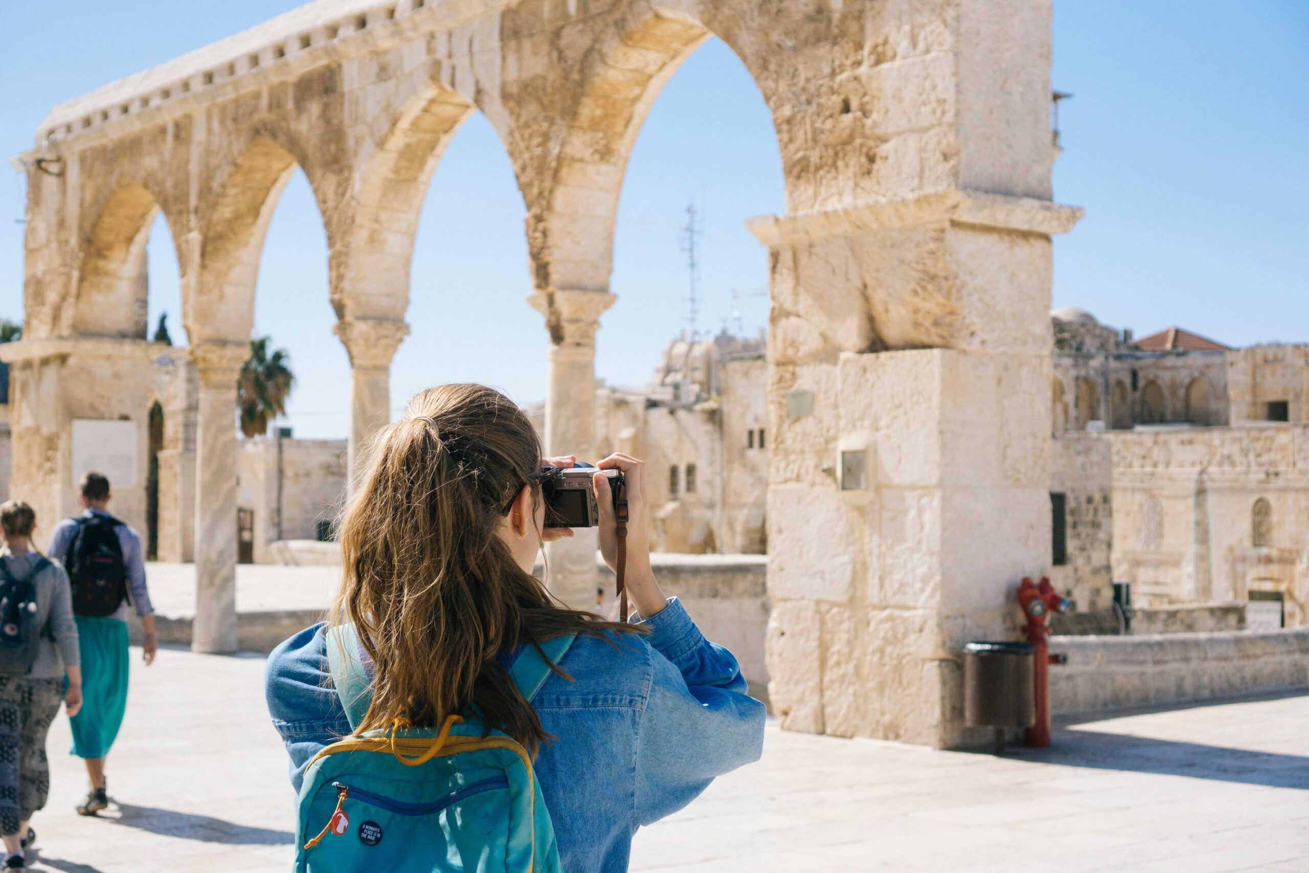 woman traveling and taking photos