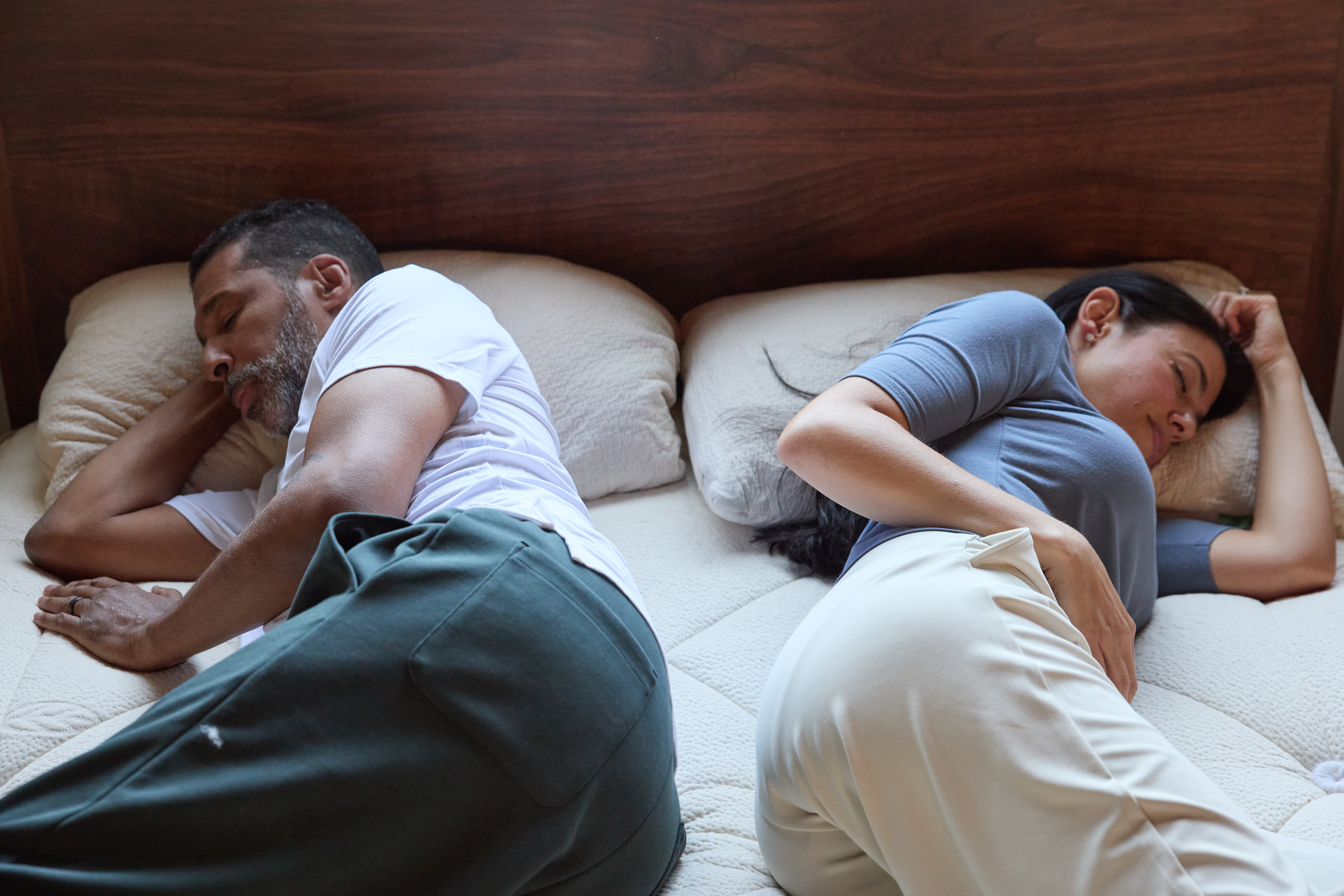 Couple laying on their side sleeping
