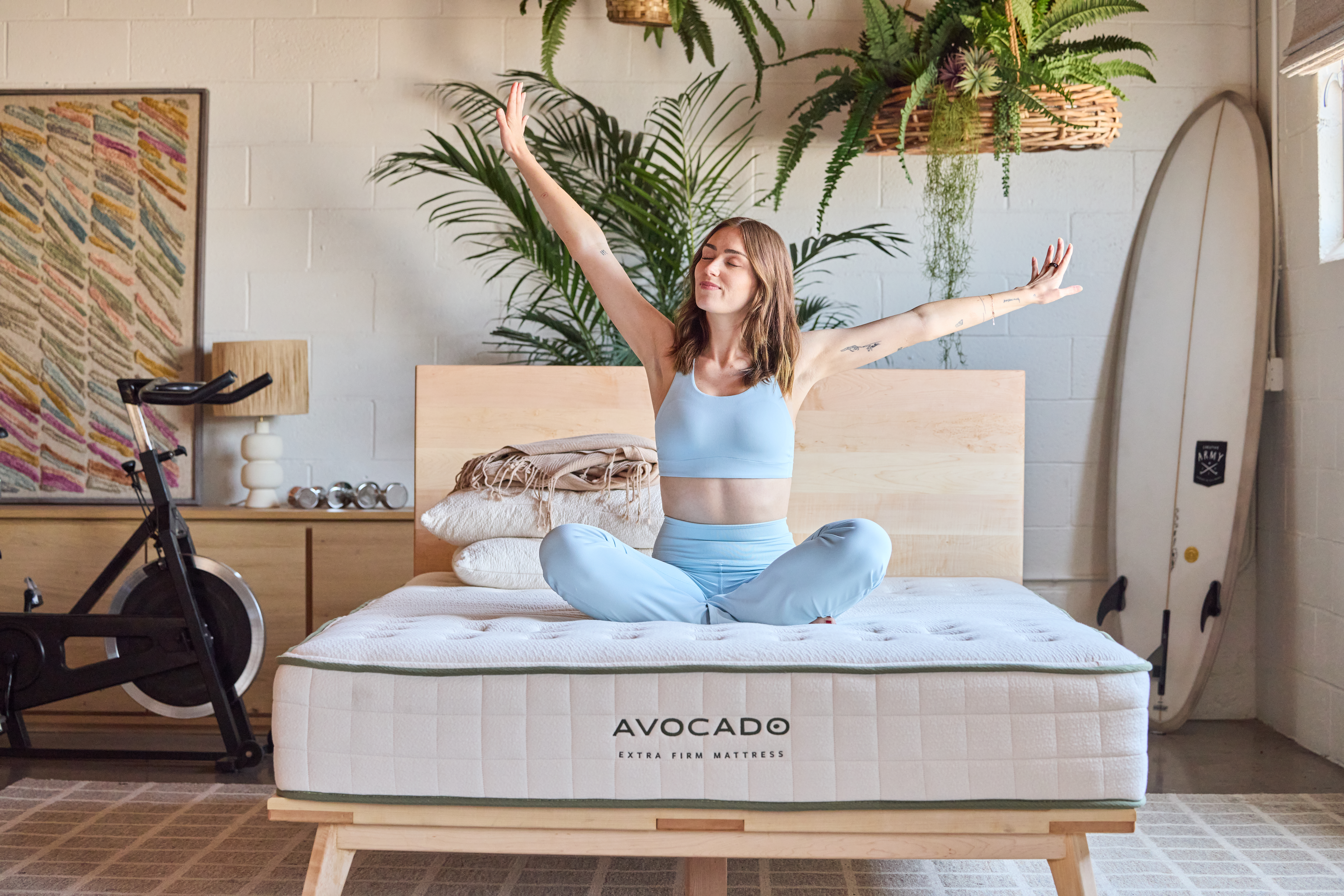 Woman stretching on Avo Extra Firm Mattress