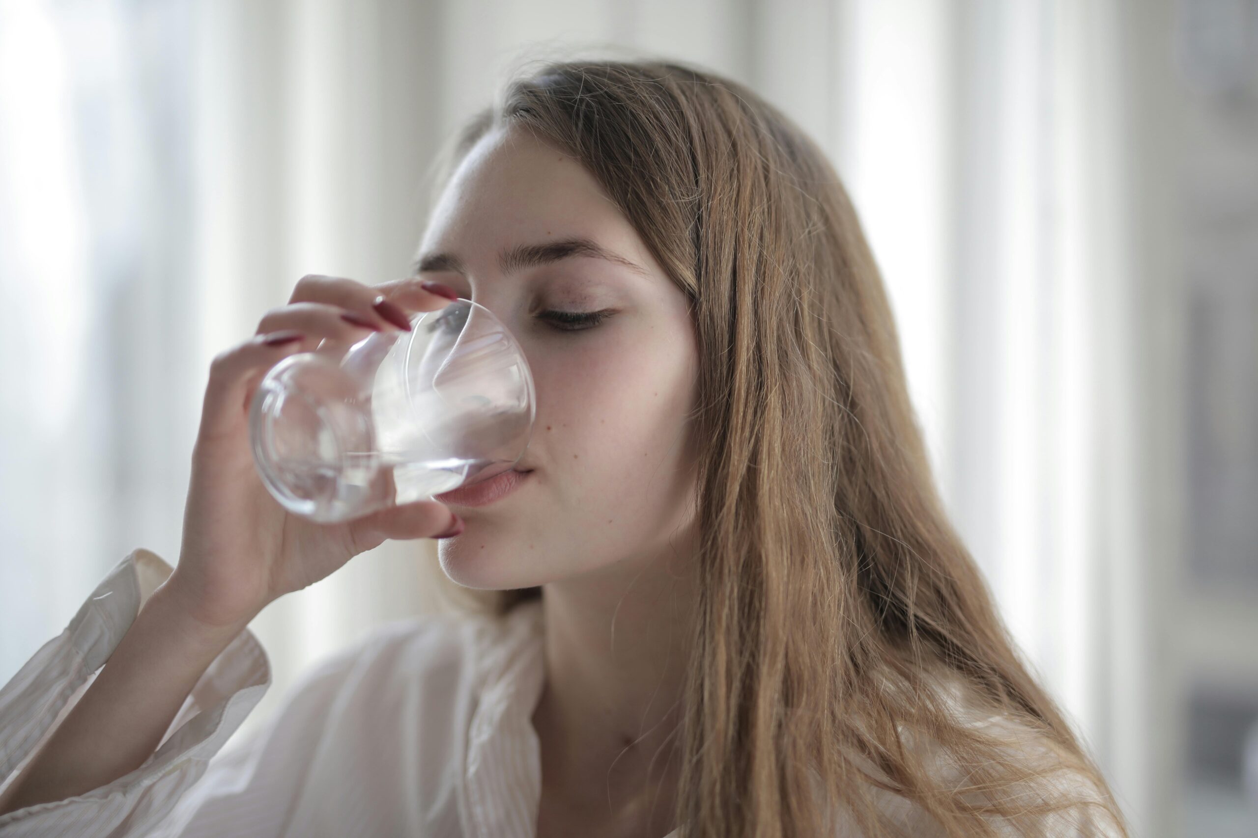 Woman drinking from a glass