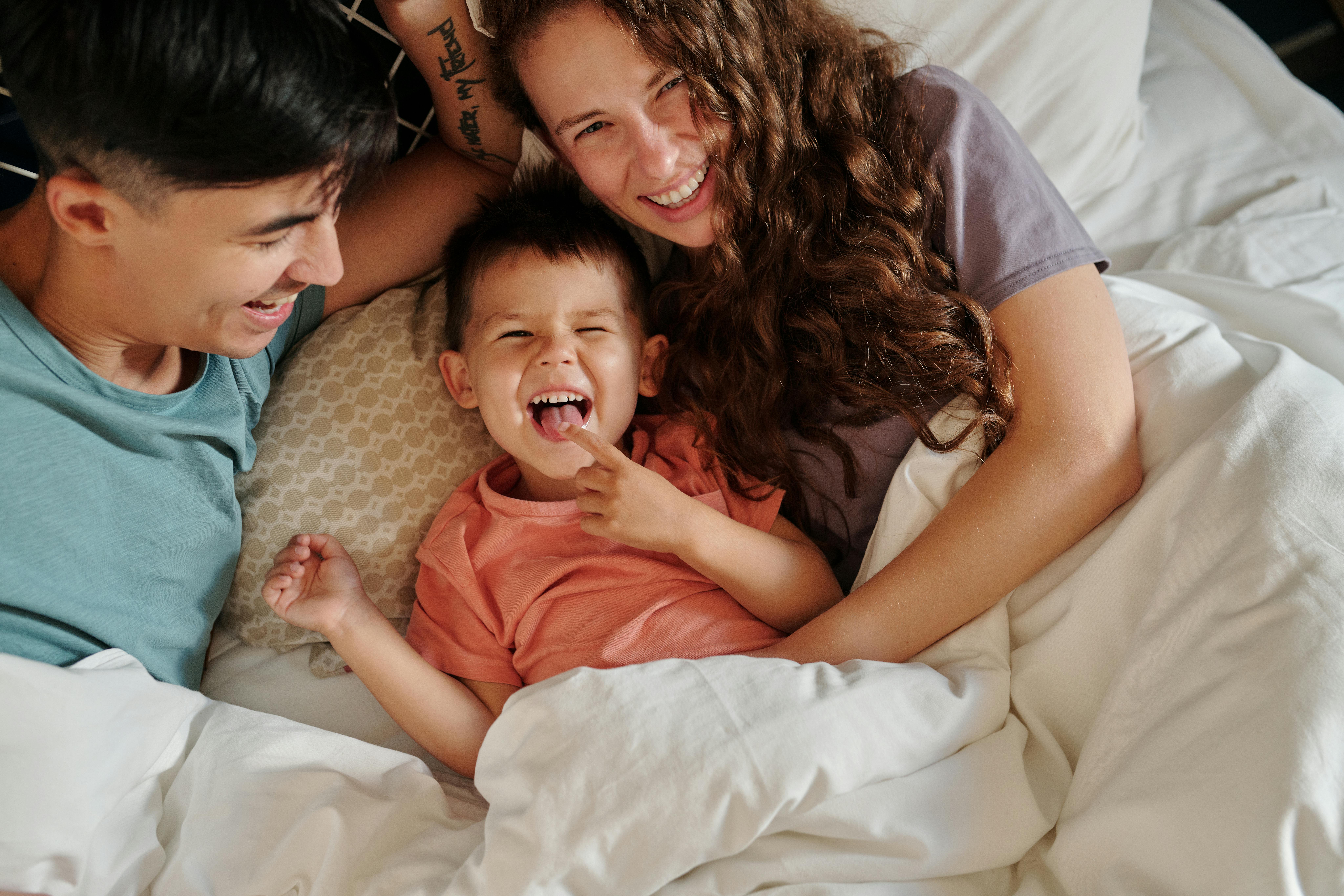 Parents laughing with Kid