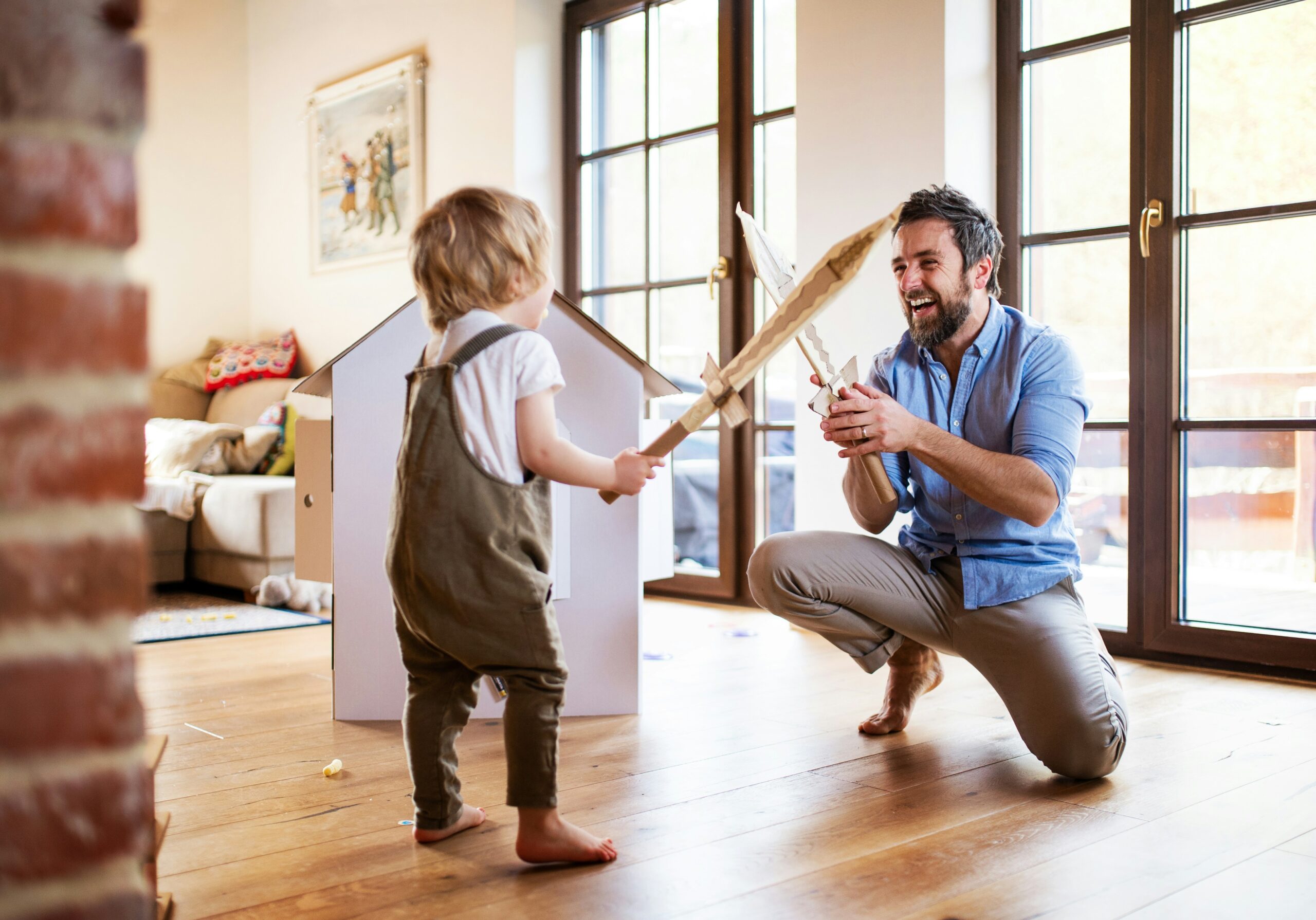 Father and Son playing indoors