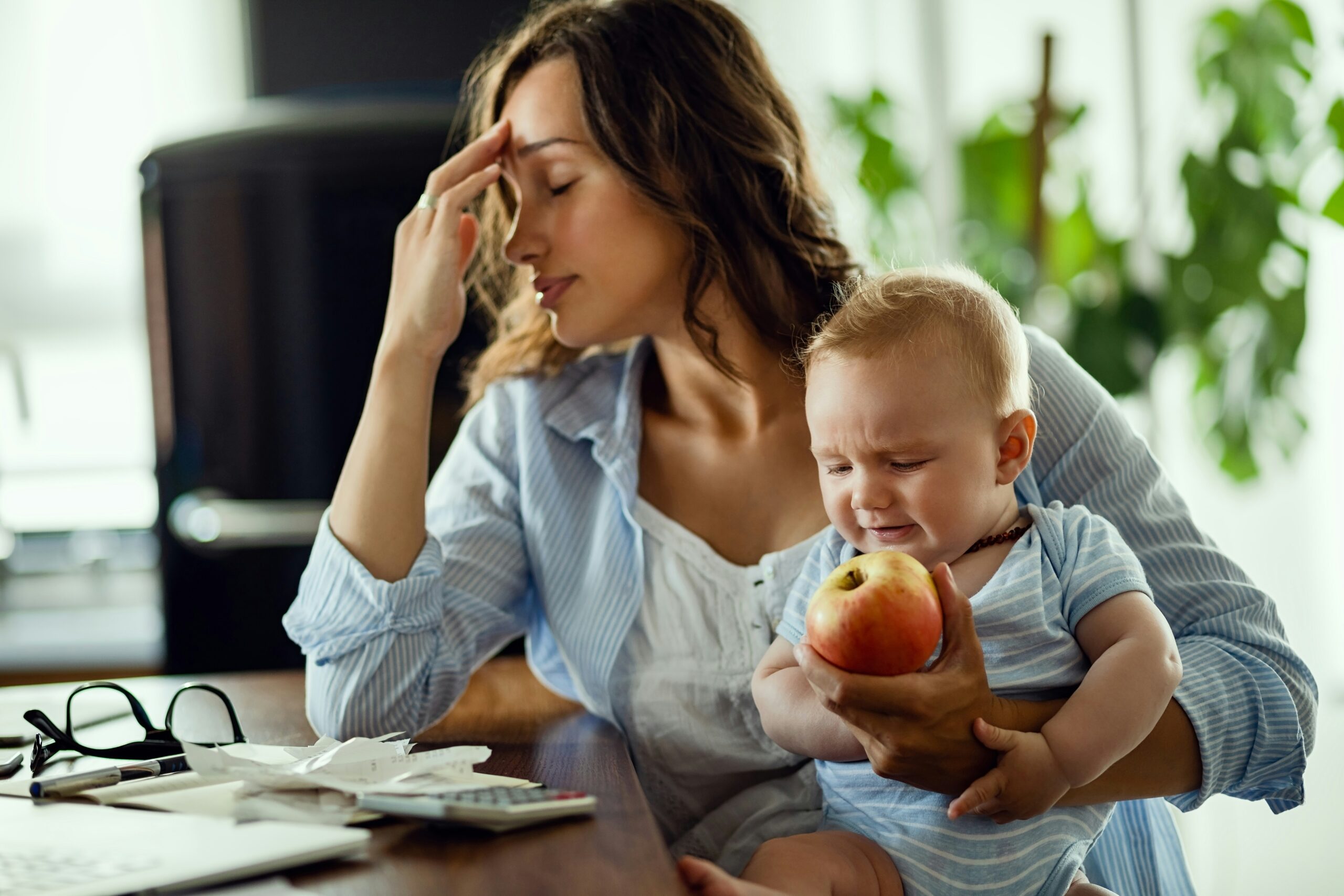 Mom Stressed with Child in arms