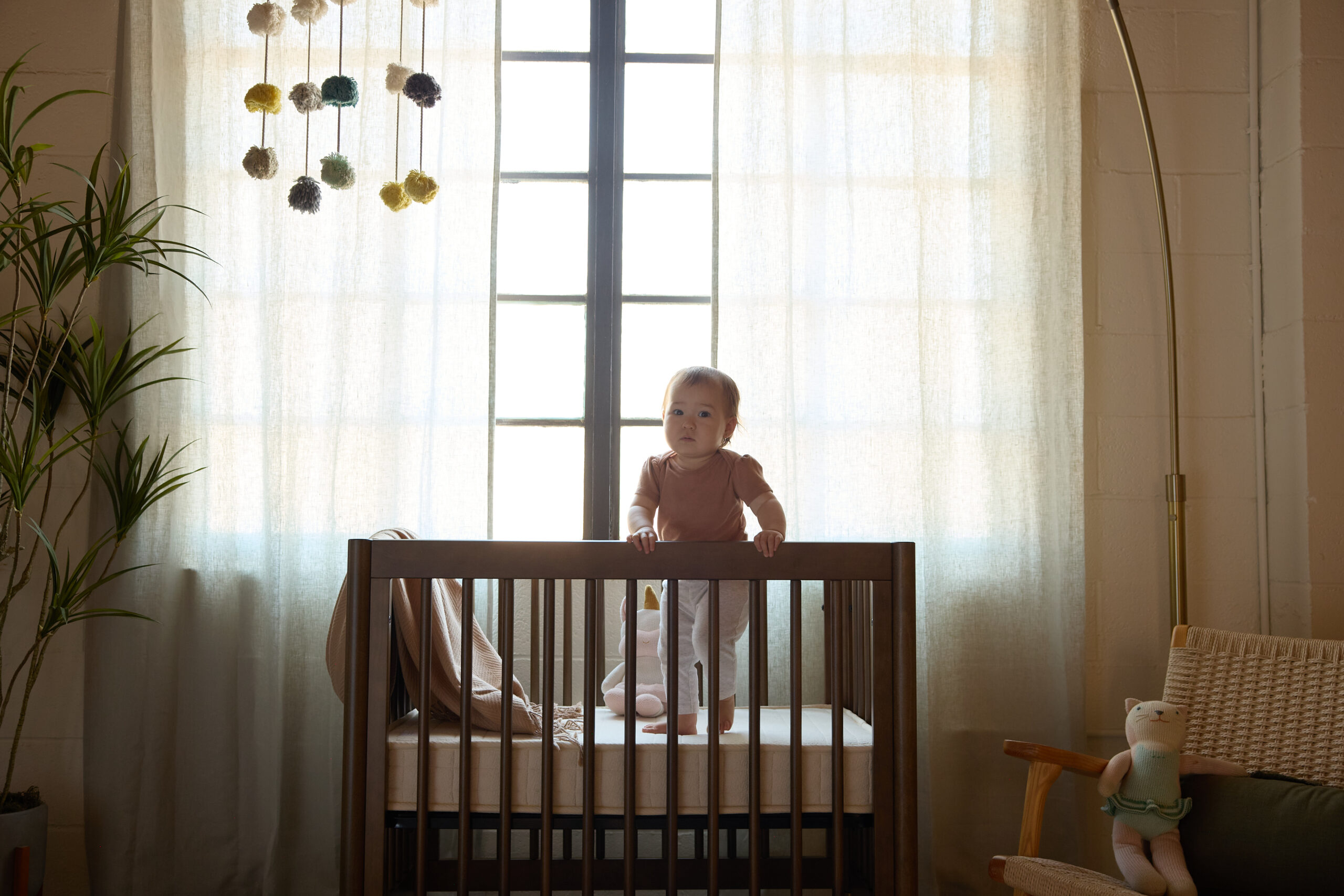 baby in the mini crib mattress