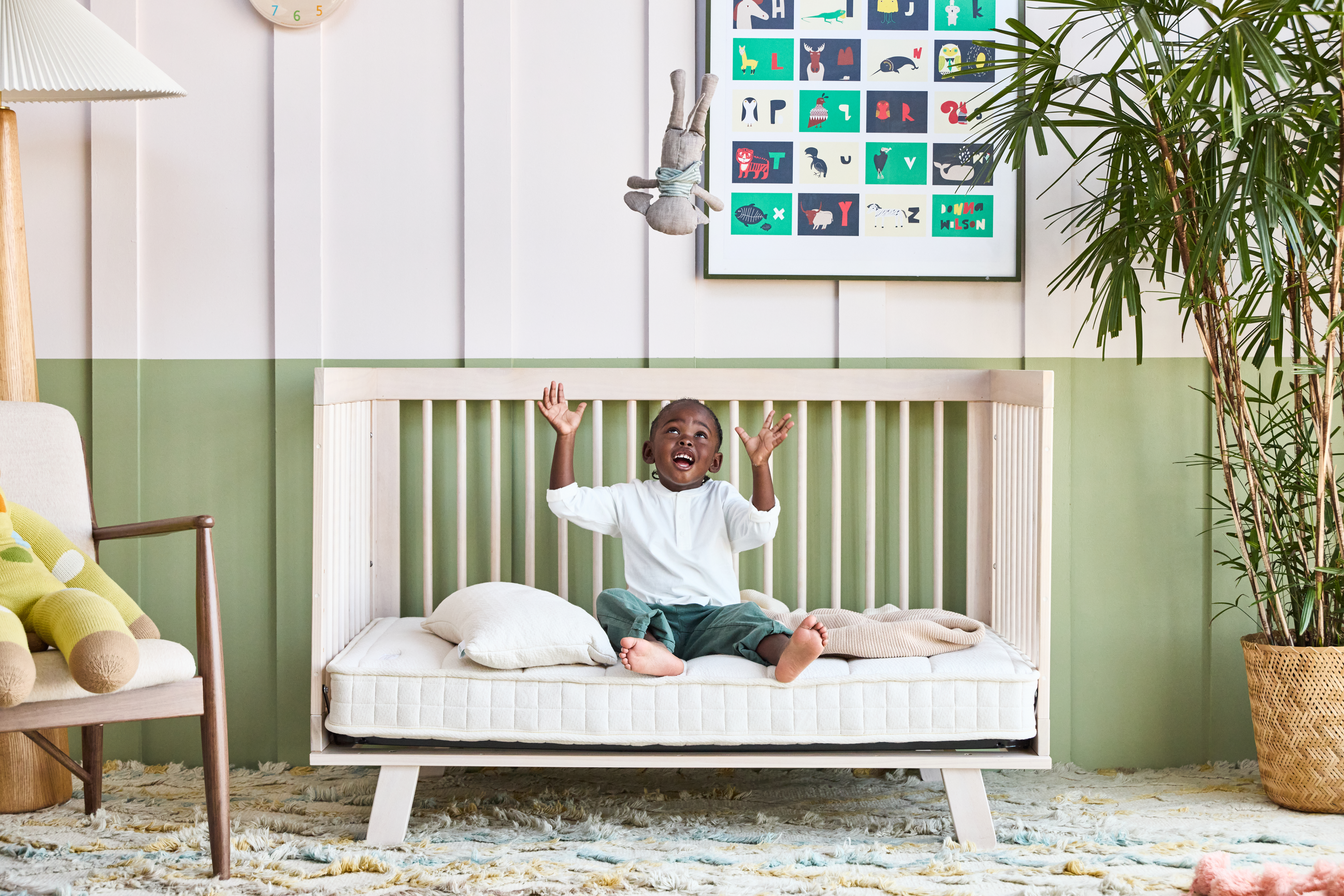 Little boy on a crib