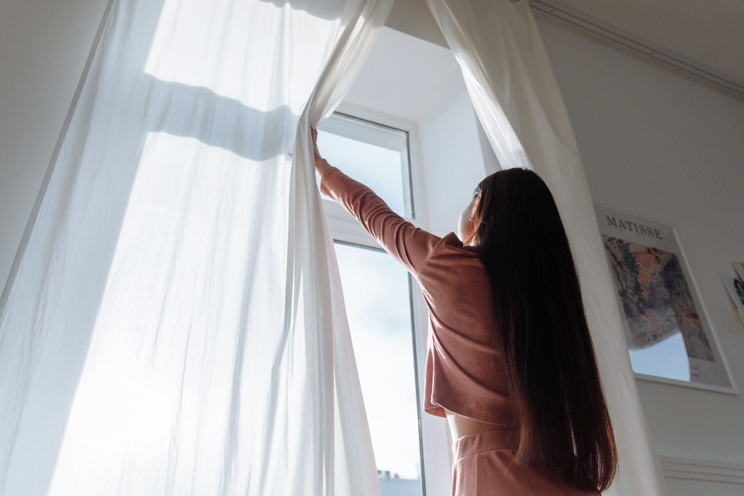 girl opening window