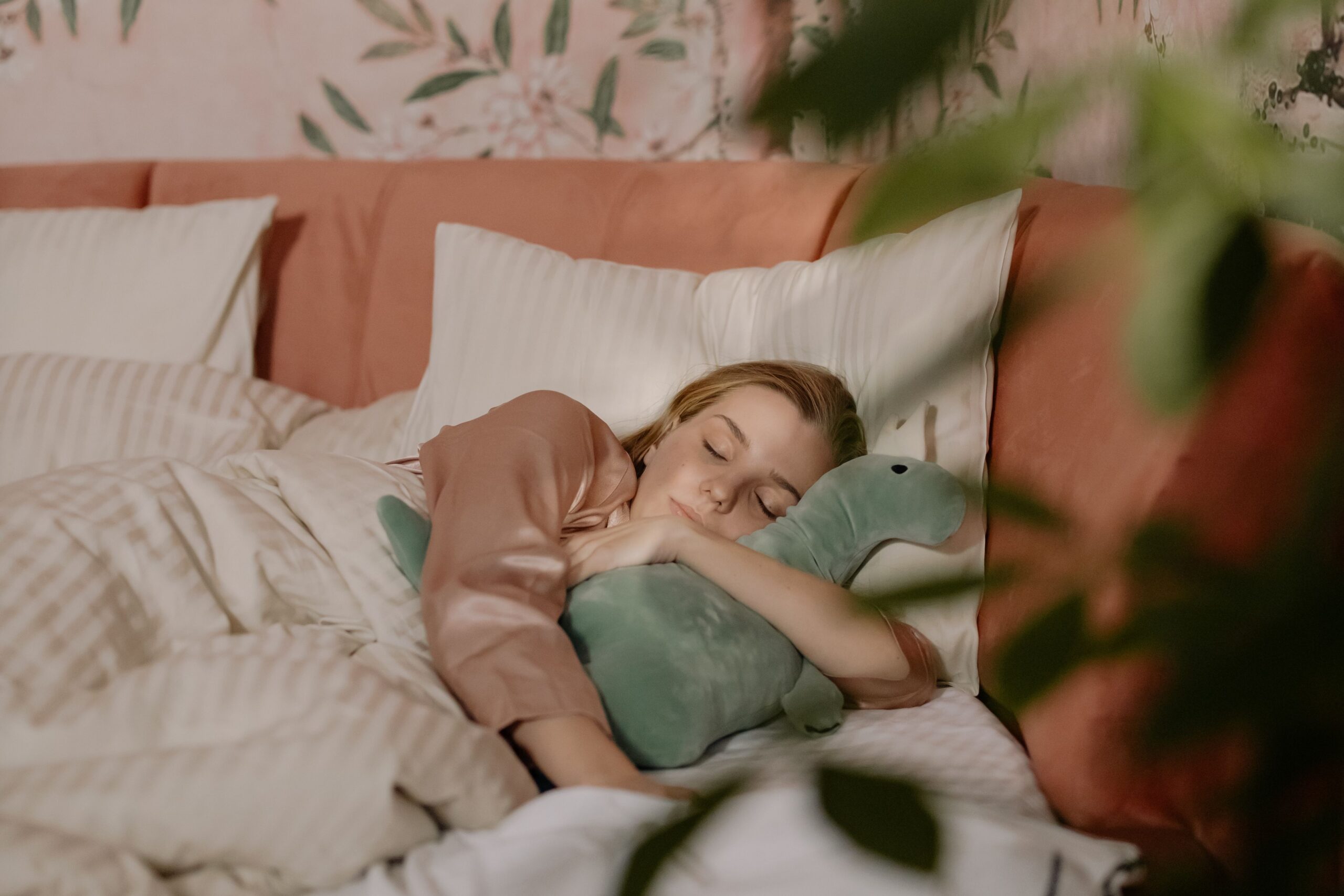 girl sleeping soundly in a lot of pink