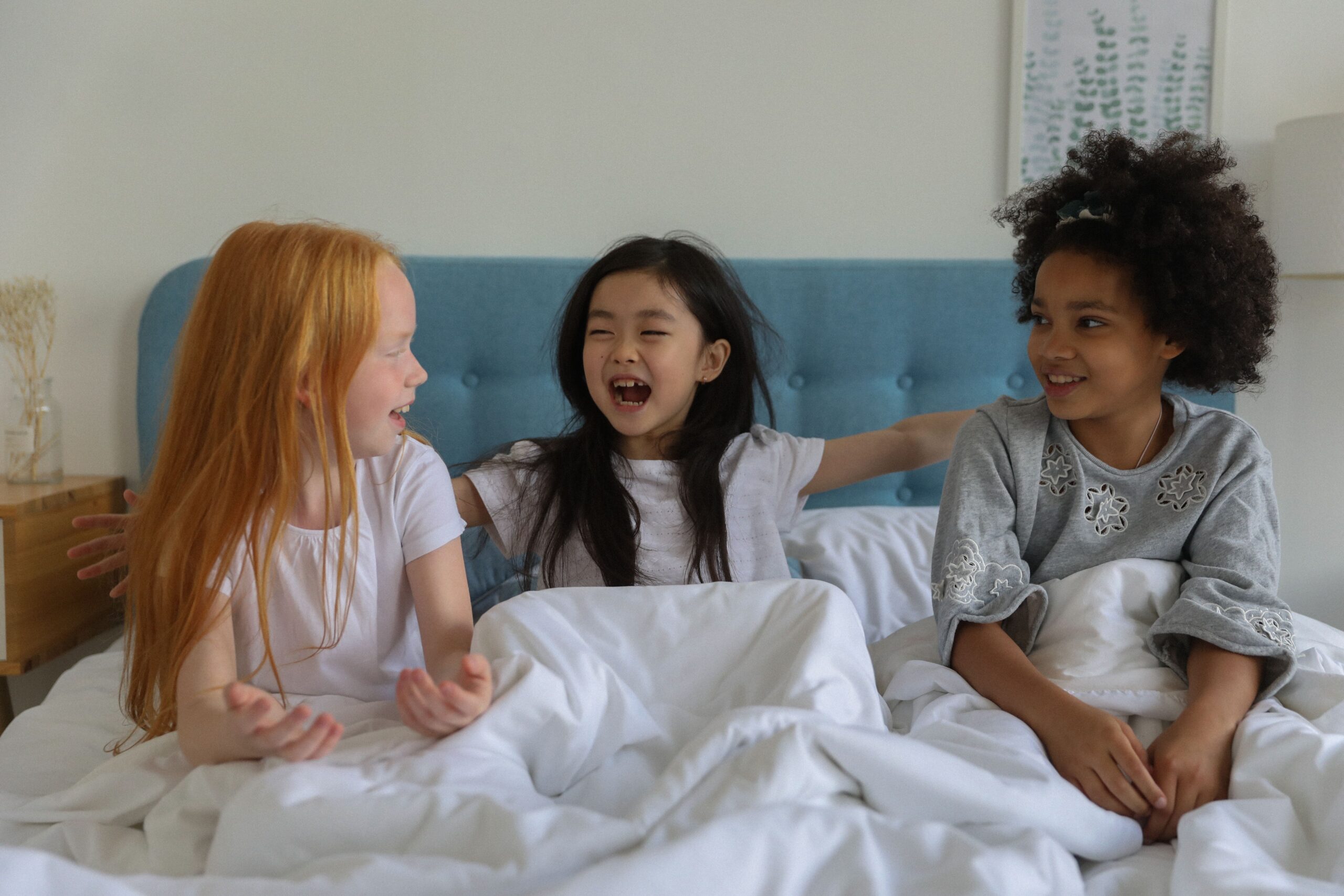 children happy in bed